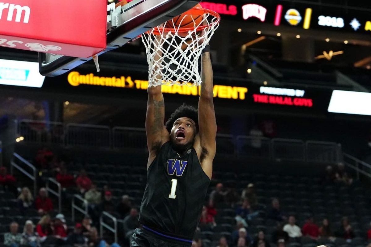 Nov 19, 2023; Las Vegas, NV, USA; Washington Huskies forward Keion Brooks Jr. (1) dunks against the San Diego State Aztecs during the second half at T-Mobile Arena.