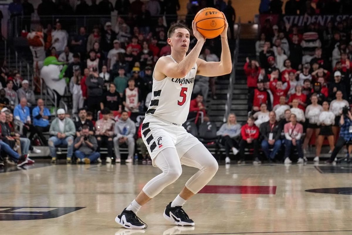 Cincinnati Bearcats guard CJ Fredrick (5) shoots a wide open three pointer in the first half of the NCAA men   s basketball game between the Cincinnati Bearcats and the Florida Gulf Coast Eagles at Fifth Third Arena in Cincinnati on Sunday, Dec. 3, 2023.