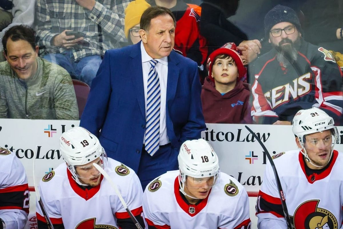 Jan 9, 2024; Calgary, Alberta, CAN; Ottawa Senators head coach Jacques Martin on his bench against the Calgary Flames during the first period at Scotiabank Saddledome.