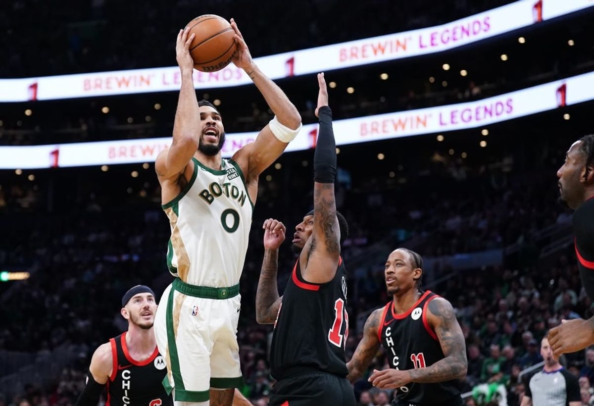 Nov 28, 2023; Boston, Massachusetts, USA; Boston Celtics forward Jayson Tatum (0) shoots against Chicago Bulls forward Torrey Craig (13) in the first quarter at TD Garden.