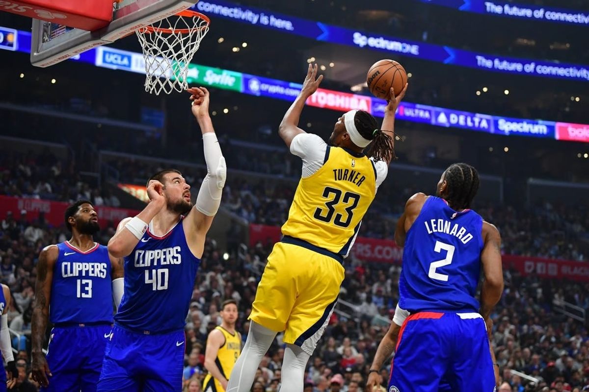 Mar 25, 2024; Los Angeles, California, USA; Indiana Pacers center Myles Turner (33) shoots against Los Angeles Clippers center Ivica Zubac (40) and forward Kawhi Leonard (2) during the first half at Crypto.com Arena.
