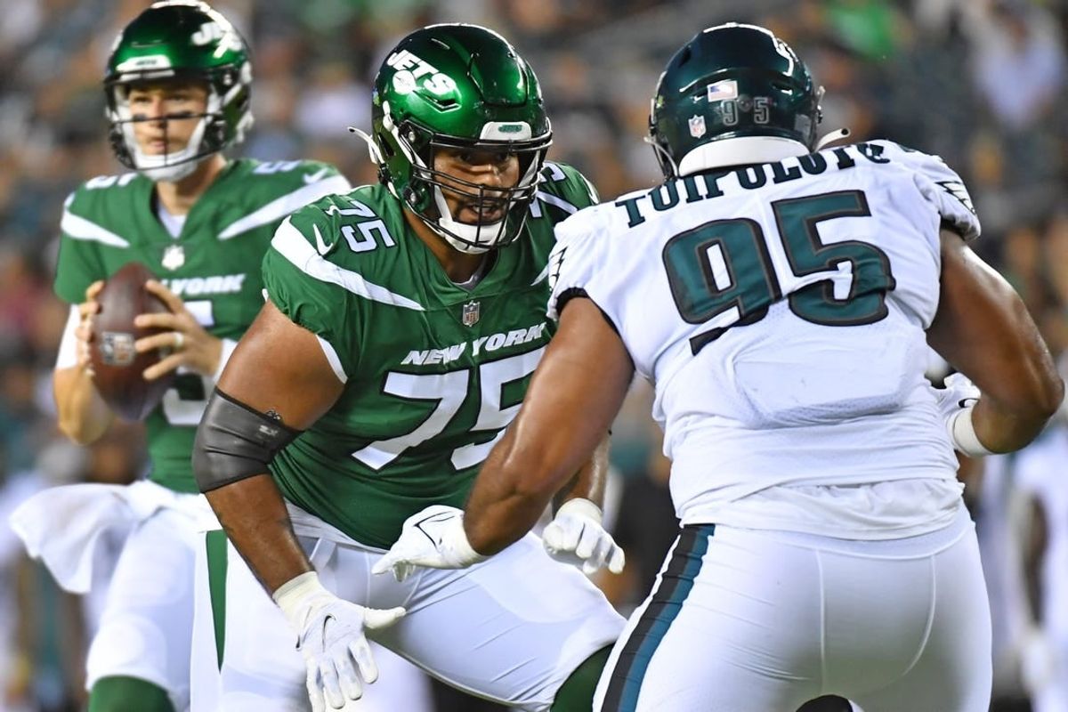 Aug 12, 2022; Philadelphia, Pennsylvania, USA; New York Jets lineman Alijah Vera-Tucker (75) blocks Philadelphia Eagles defensive tackle Marlon Tuipulotu (95) at Lincoln Financial Field.