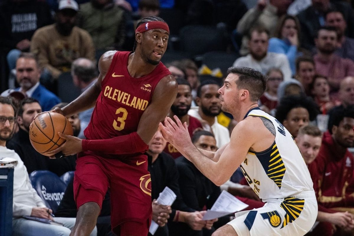 Mar 18, 2024; Indianapolis, Indiana, USA; Cleveland Cavaliers guard Caris LeVert (3) holds the ball while Indiana Pacers guard T.J. McConnell (9) defends in the first half at Gainbridge Fieldhouse.