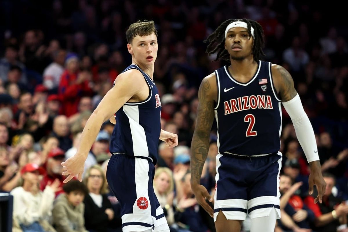 Jan 17, 2024; Tucson, Arizona, USA; Arizona Wildcats guard Pelle Larsson (3) runs down the court with guard Caleb Love (2) against the USC Trojans during the second half at McKale Center.
