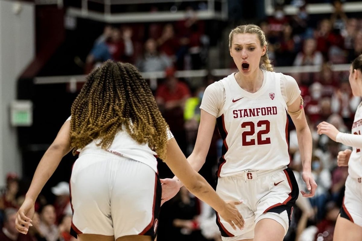 Feb 20, 2023; Stanford, California, USA;  Stanford Cardinal forward Cameron Brink (22) is congratulated by guard Haley Jones (30) after scoring against the UCLA Bruins during the second half at Maples Pavilion.