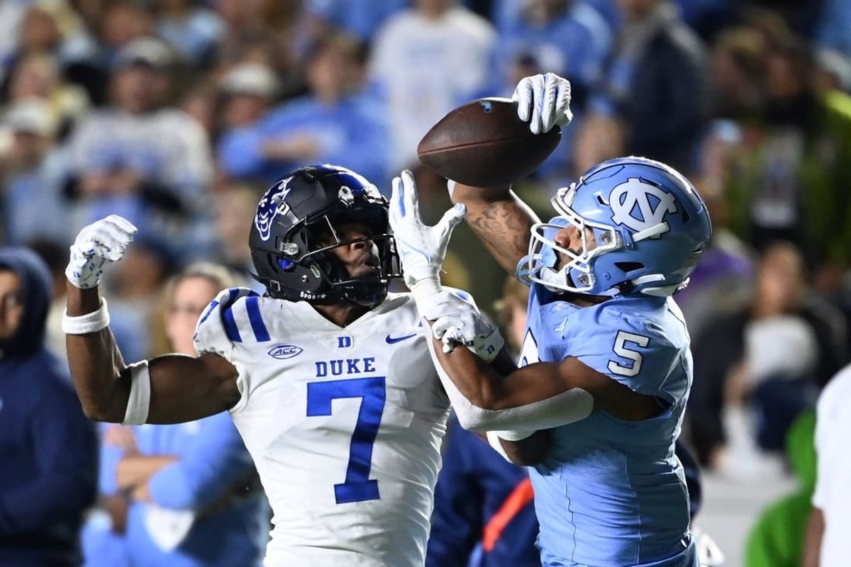 Nov 11, 2023; Chapel Hill, North Carolina, USA; North Carolina Tar Heels wide receiver J.J. Jones (5) catches the ball as Duke Blue Devils cornerback Al Blades Jr. (7) defends in the second quarter at Kenan Memorial Stadium.
