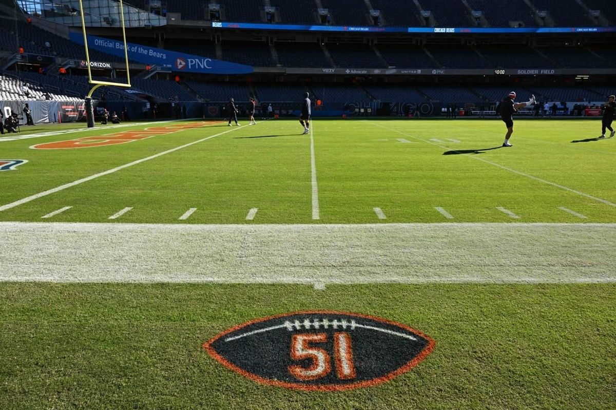 Oct 22, 2023; Chicago, Illinois, USA; A general view of a logo painted on the sideline to honor the memory of former Chicago Bear and Hall of Famer Dick Butkus before a game between the Las Vegas Raiders and the Chicago Bears at Soldier Field.