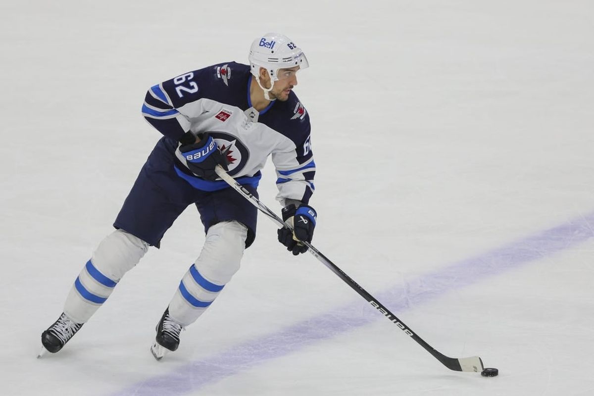 Nov 24, 2023; Sunrise, Florida, USA; Winnipeg Jets right wing Nino Niederreiter (62) moves the puck against the Florida Panthers during the third period at Amerant Bank Arena.