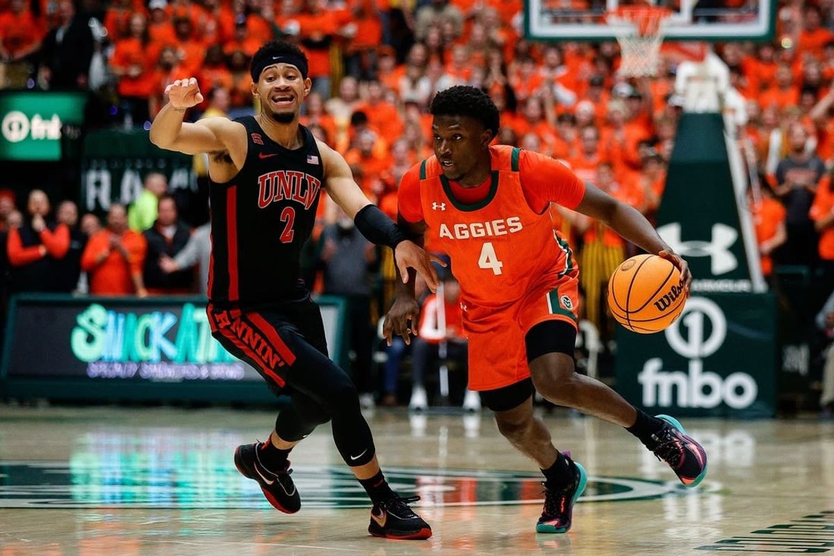Jan 19, 2024; Fort Collins, Colorado, USA; Colorado State Rams guard Isaiah Stevens (4) controls the ball as UNLV Rebels guard Justin Webster (2) guards in the second half at Moby Arena.