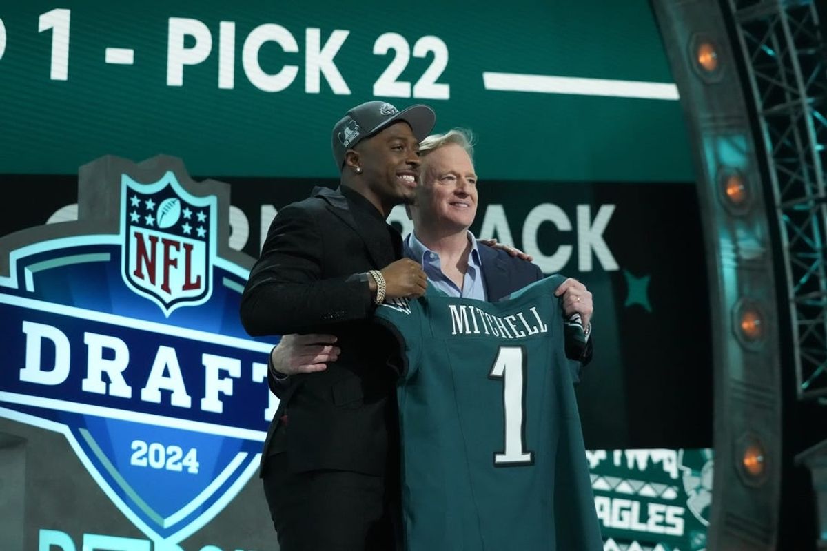 Toledo Rockets cornerback Quinyon Mitchell poses with NFL commissioner Roger Goodell after being selected by the Philadelphia Eagles as the No. 22 pick in the first round of the 2024 NFL Draft at Campus Martius Park and Hart Plaza.
