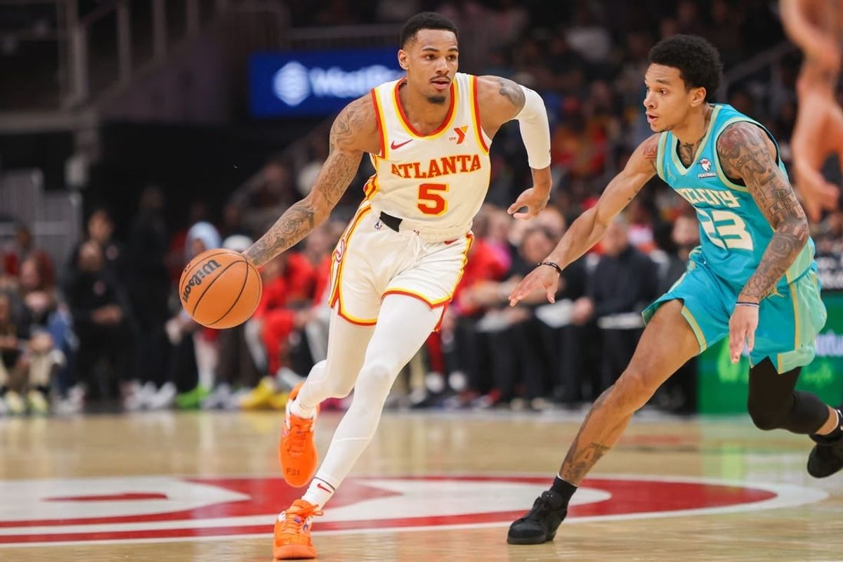 Mar 23, 2024; Atlanta, Georgia, USA; Atlanta Hawks guard Dejounte Murray (5) is defended by Charlotte Hornets guard Tre Mann (23) in the first quarter at State Farm Arena.