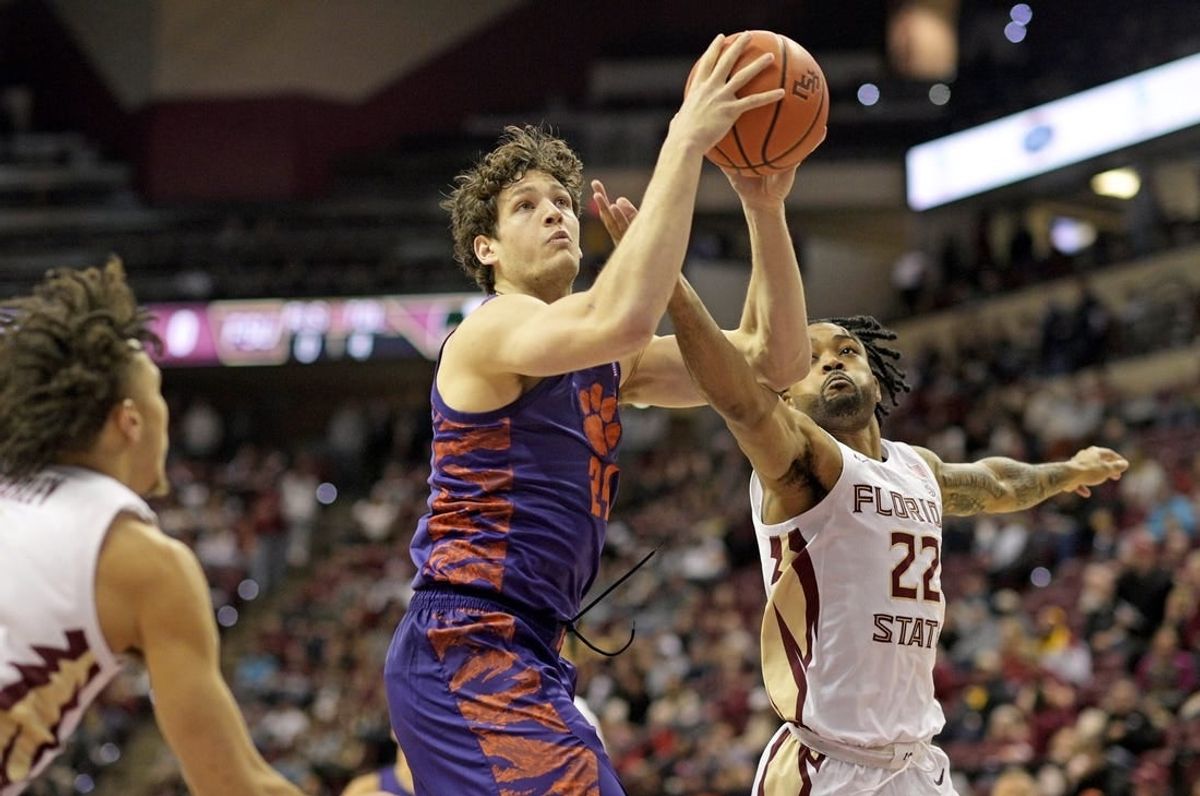 Jan 20, 2024; Tallahassee, Florida, USA; Florida State Seminoles guard Darin Green Jr (22) pressures Clemson Tigers center PJ Hall (24) during the first half at Donald L. Tucker Center.
