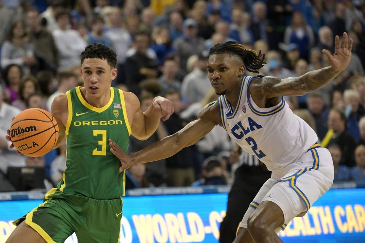 Feb 3, 2024; Los Angeles, California, USA; Oregon Ducks guard Jackson Shelstad (3) drives past UCLA Bruins guard Dylan Andrews (2) in the second half at Pauley Pavilion presented by Wescom.