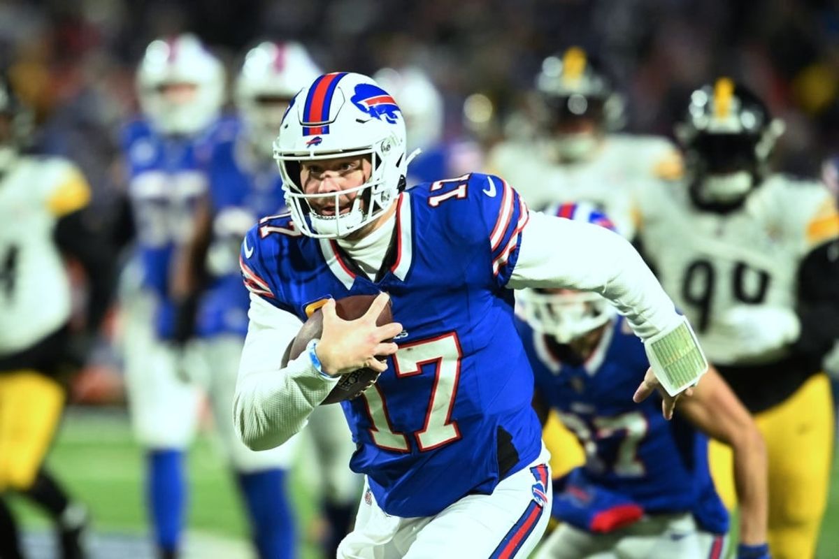 Jan 15, 2024; Orchard Park, New York, USA; Buffalo Bills quarterback Josh Allen (17) runs the ball in the first half against the Pittsburgh Steelers in a 2024 AFC wild card game at Highmark Stadium.
