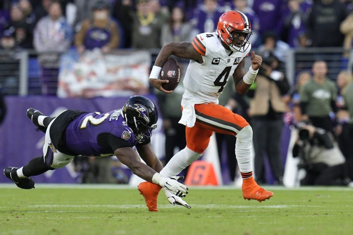 Nov 12, 2023; Baltimore, Maryland, USA; Cleveland Browns quarterback Deshaun Watson (4) runs with the ball as Baltimore Ravens defensive tackle Justin Madubuike (92) defends during the second half at M&T Bank Stadium.
