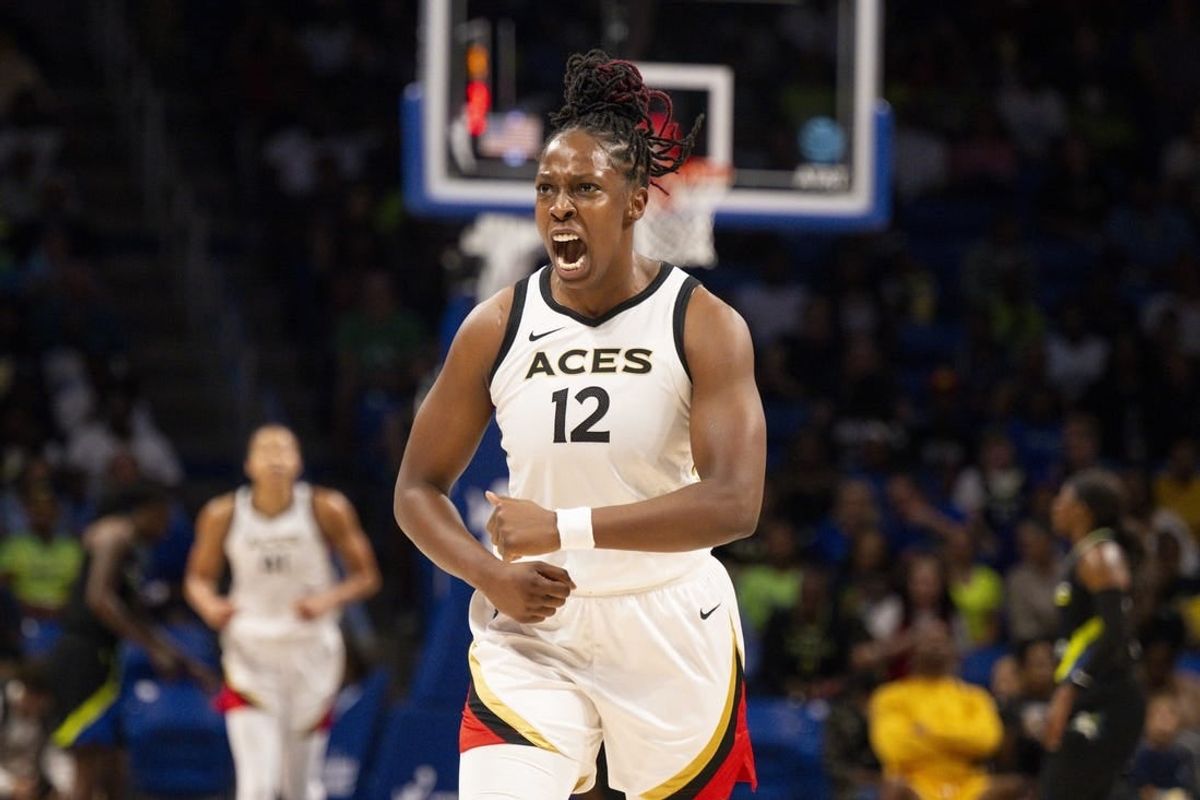 Sep 29, 2023; Arlington, Texas, USA; Las Vegas Aces guard Chelsea Gray (12) celebrates during the first half against the Dallas Wings during game three of the 2023 WNBA Playoffs at College Park Center.