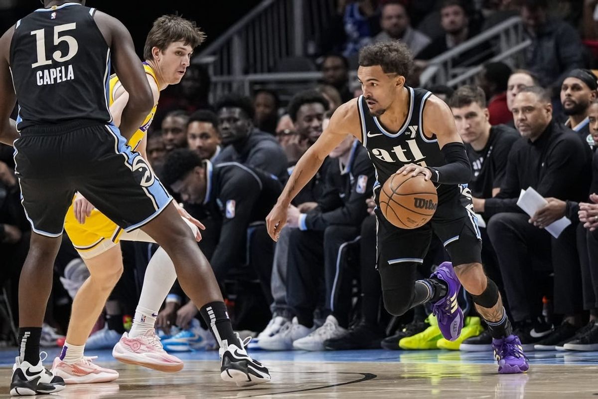 Jan 30, 2024; Atlanta, Georgia, USA; Atlanta Hawks guard Trae Young (11) dribbles against the Los Angeles Lakers during the first half at State Farm Arena.