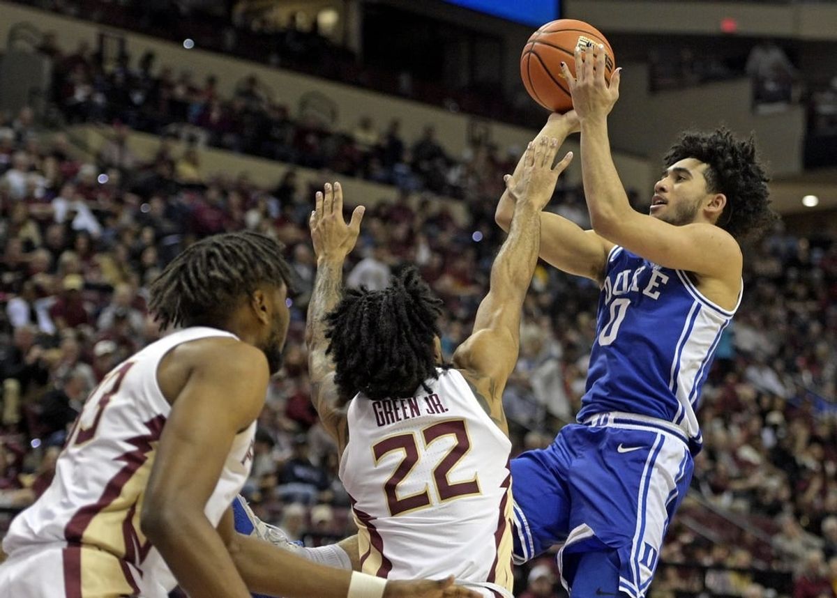 Feb 17, 2024; Tallahassee, Florida, USA; Duke Blue Devils guard Jared McCain (0) shoots the ball over Florida State Seminoles guard Darin Green Jr (22) during the second half at Donald L. Tucker Center.