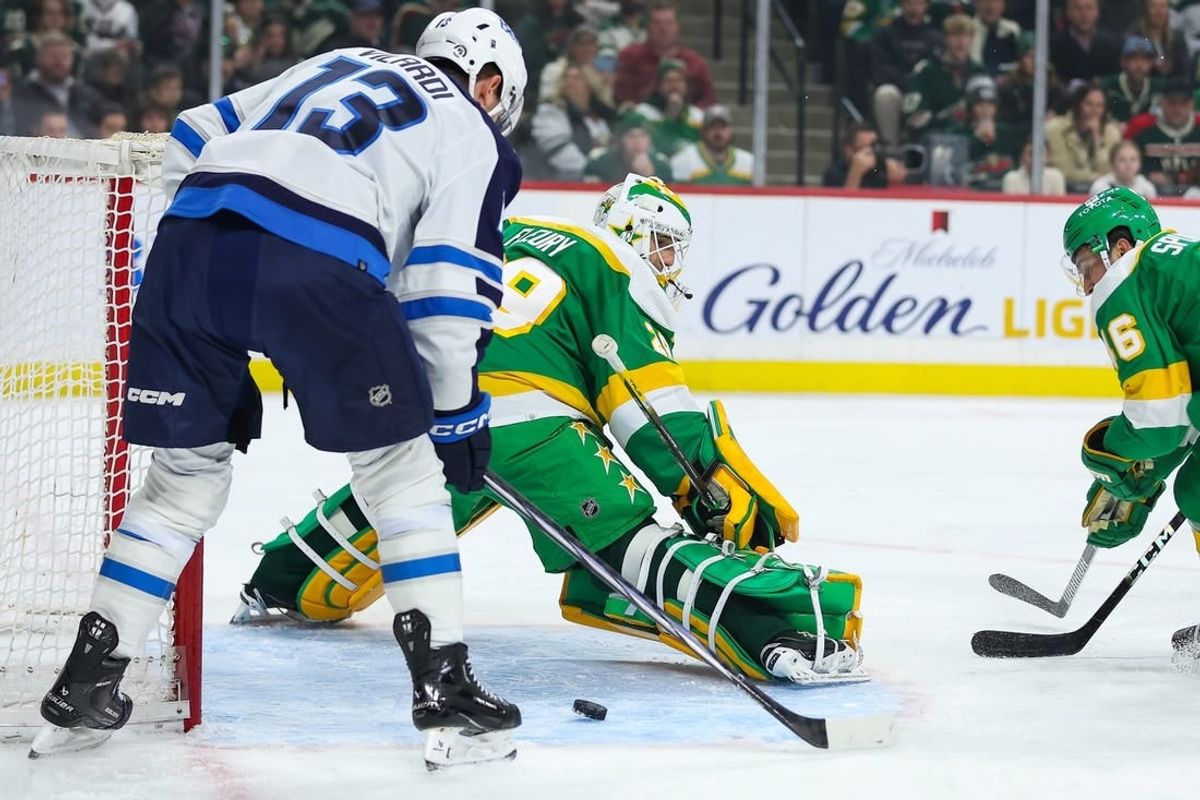 Dec 31, 2023; Saint Paul, Minnesota, USA; Minnesota Wild goaltender Marc-Andre Fleury (29) defends his net as Winnipeg Jets center Gabriel Vilardi (13) looks to shoot during the first period at Xcel Energy Center.