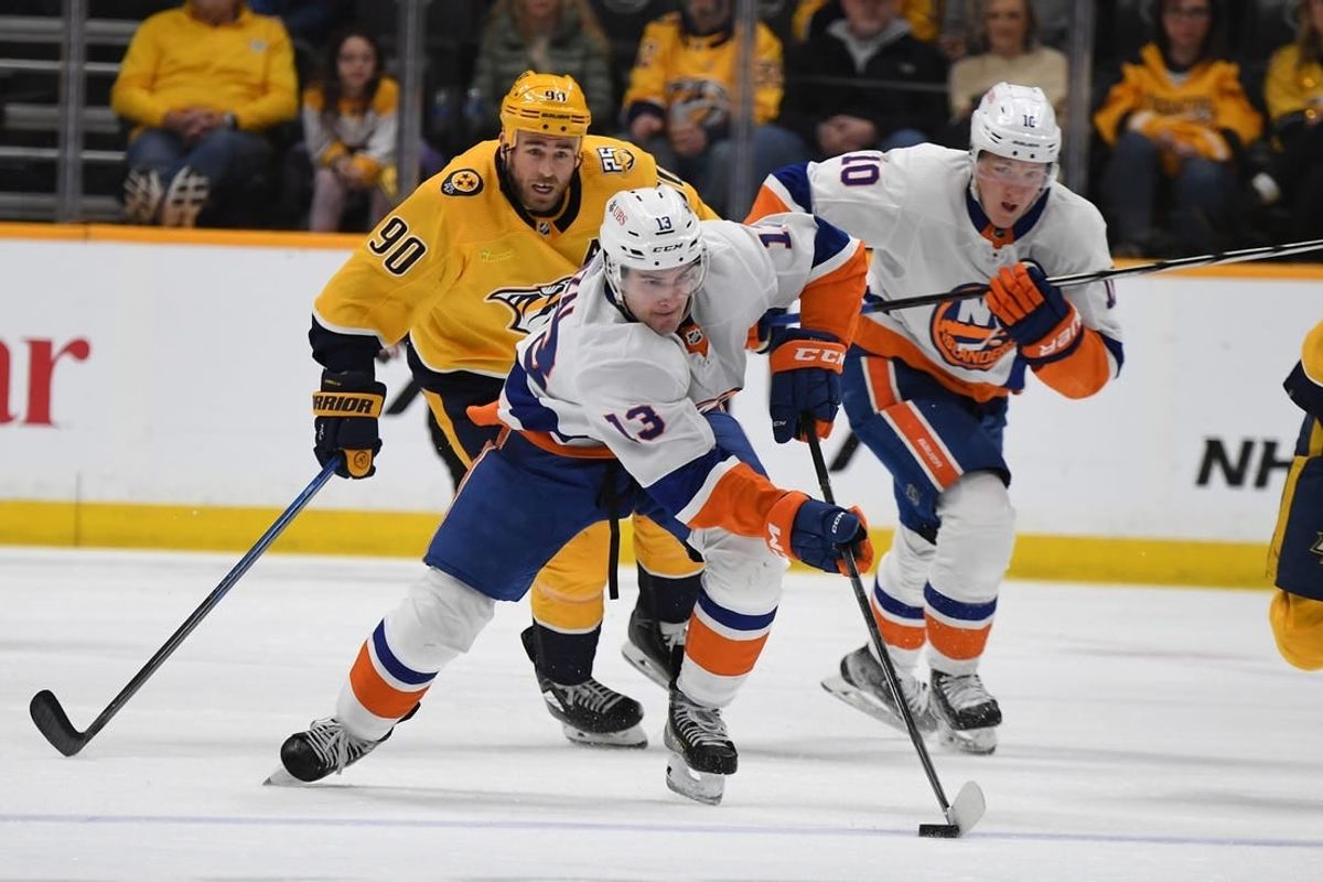 Jan 13, 2024; Nashville, Tennessee, USA; New York Islanders center Mathew Barzal (13) skates with the puck during the second period against the Nashville Predators at Bridgestone Arena.