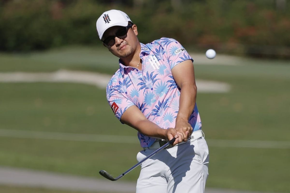 Apr 5, 2024; Miami, Florida, USA; Jinichiro Kozuma of the Ironheads chips onto the 16th green during the first round of LIV Golf Miami golf tournament at Trump National Doral.
