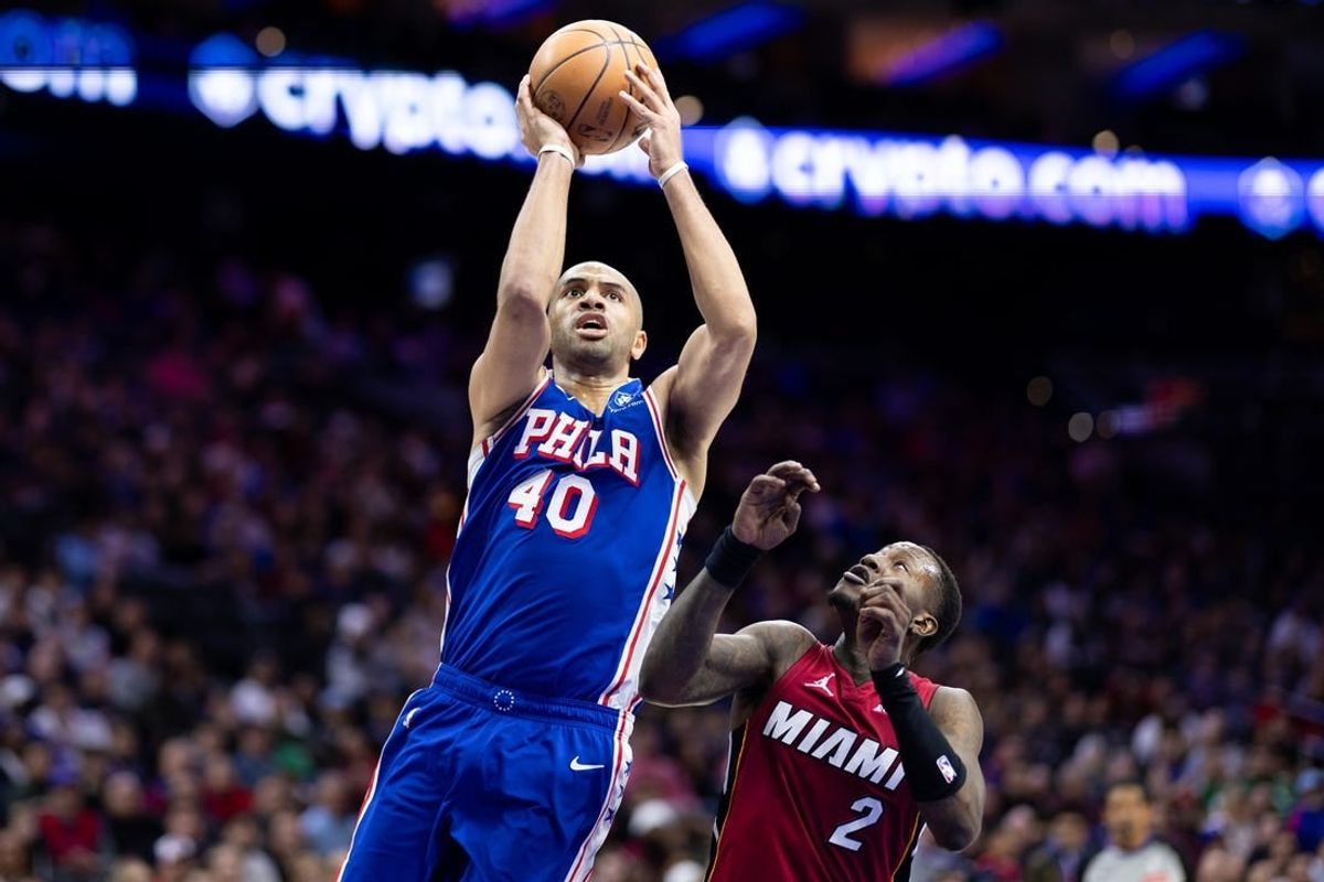 Mar 18, 2024; Philadelphia, Pennsylvania, USA; Philadelphia 76ers forward Nicolas Batum (40) drives for a shot agains Miami Heat guard Terry Rozier (2) during the second quarter at Wells Fargo Center.