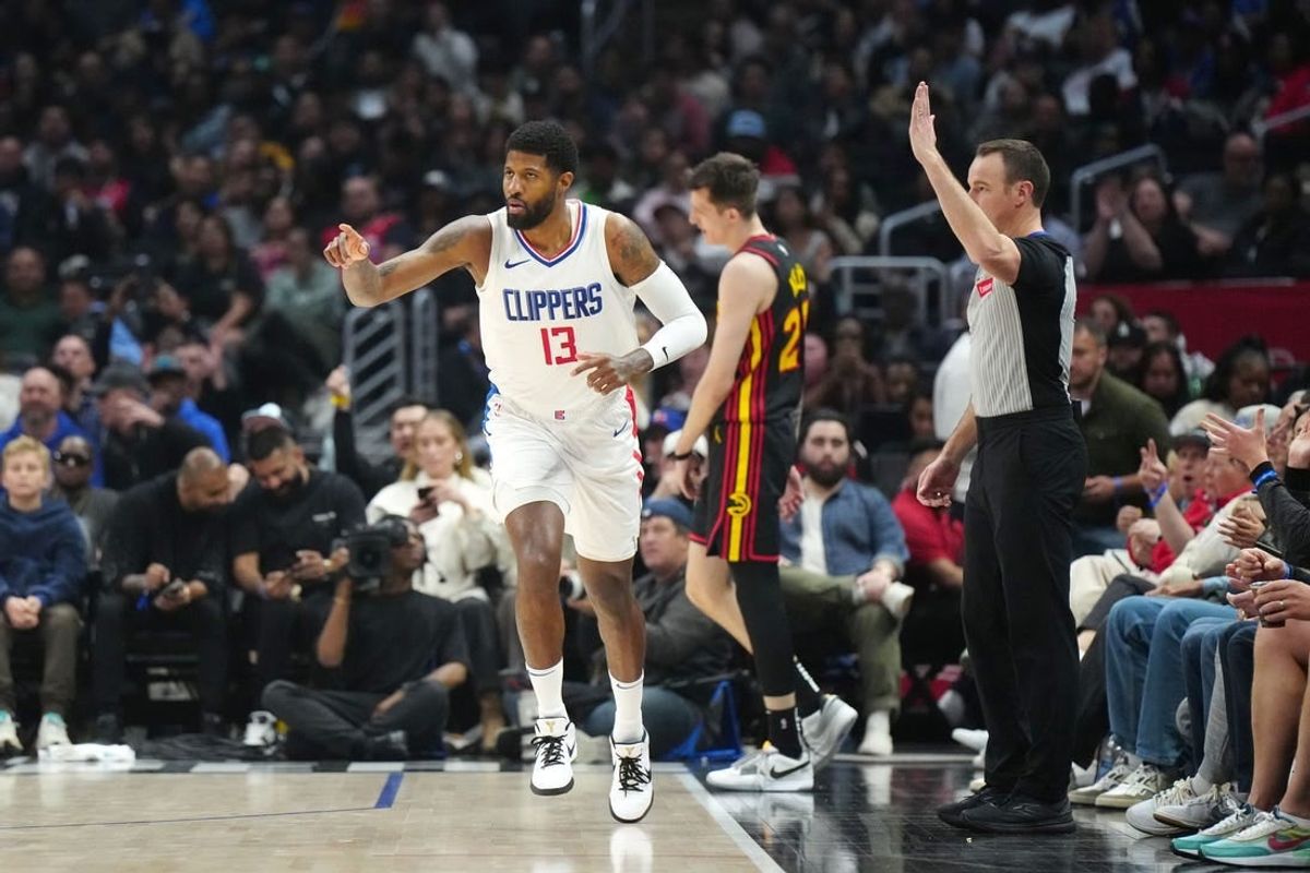 Mar 17, 2024; Los Angeles, California, USA; LA Clippers forward Paul George (13) gestures after a three-point basket against the Atlanta Hawks in the second half at Crypto.com Arena.