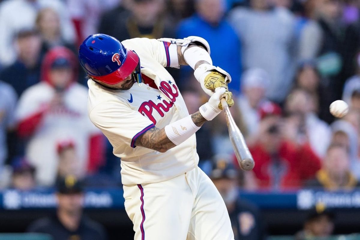 Apr 13, 2024; Philadelphia, Pennsylvania, USA; Philadelphia Phillies outfielder Nick Castellanos (8) hits a walk off RBI single during the ninth inning against the Pittsburgh Pirates at Citizens Bank Park.