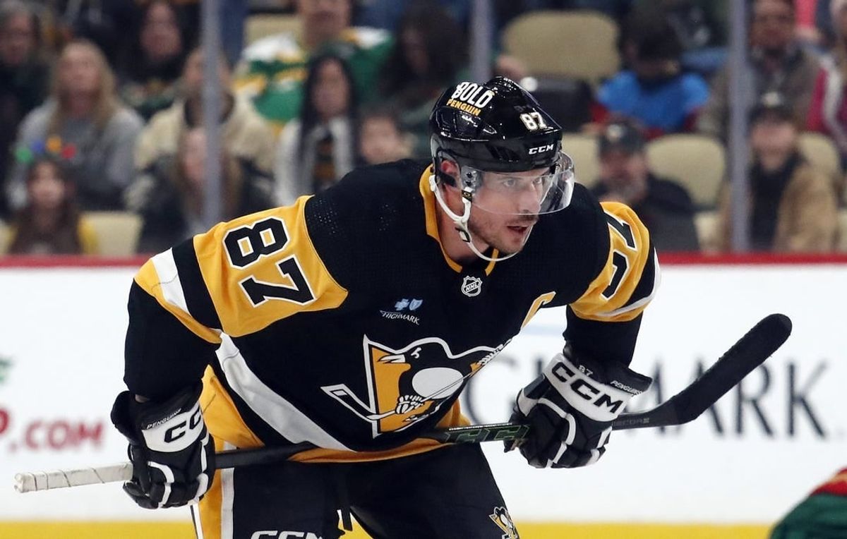 Dec 18, 2023; Pittsburgh, Pennsylvania, USA;  Pittsburgh Penguins center Sidney Crosby (87) prepares to take a face-off against the Minnesota Wild during the third period at PPG Paints Arena. Pittsburgh won 4-3.