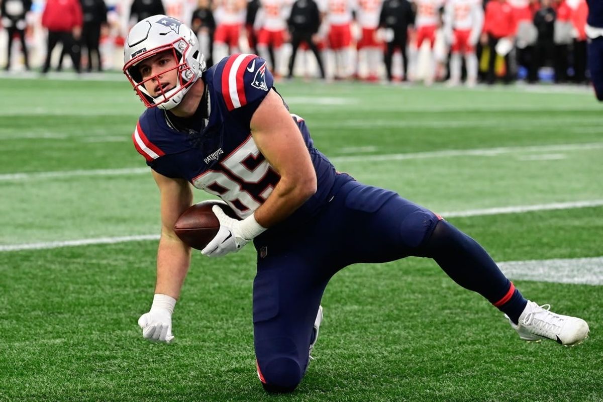 Dec 17, 2023; Foxborough, Massachusetts, USA; New England Patriots tight end Hunter Henry (85) scores a touchdown against the Kansas City Chiefs during the first half at Gillette Stadium.