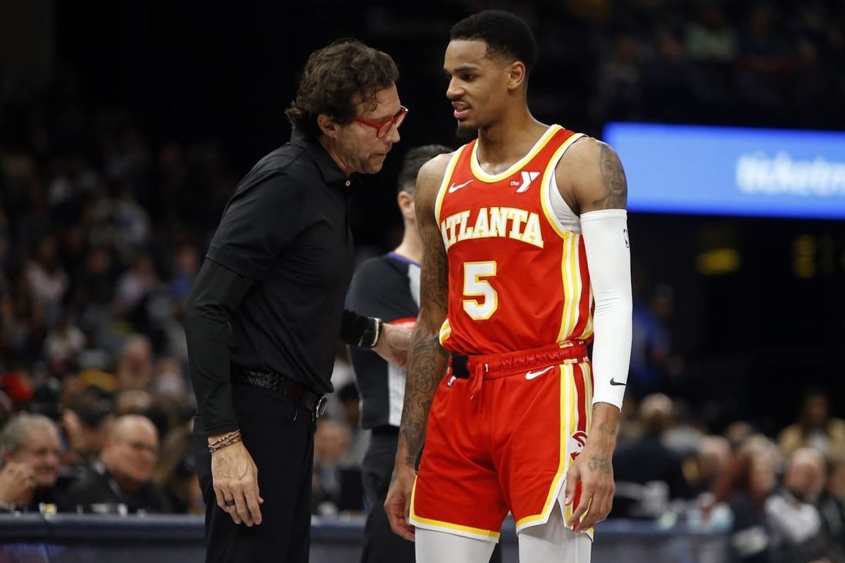 Mar 8, 2024; Memphis, Tennessee, USA; Atlanta Hawks head coach Quin Snyder (left) talks with Atlanta Hawks guard Dejounte Murray (5) during the first half against the Memphis Grizzlies at FedExForum.