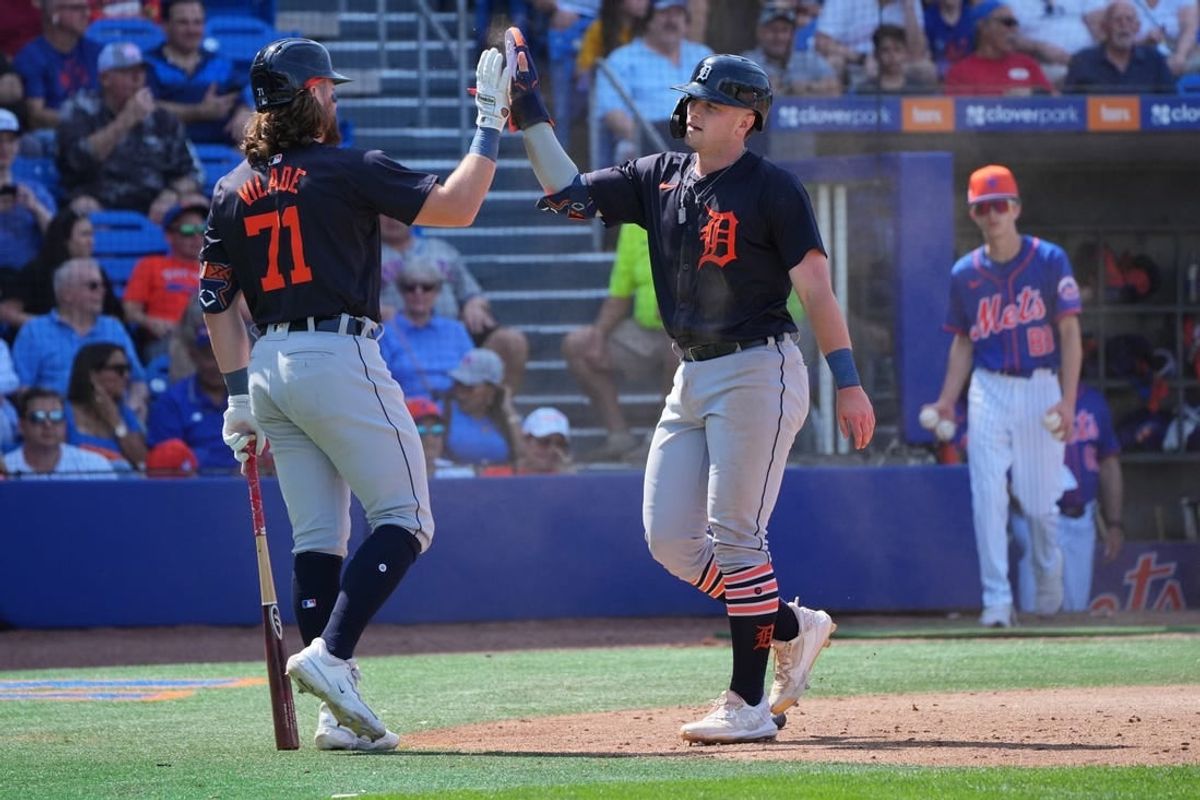 Mar 10, 2024; Port St. Lucie, Florida, USA;  Detroit Tigers second baseman Jace Jung (84) is congratulated by first baseman Ryan Vilade (71) for scoring a run in the eighth inning against the New York Mets at Clover Park.