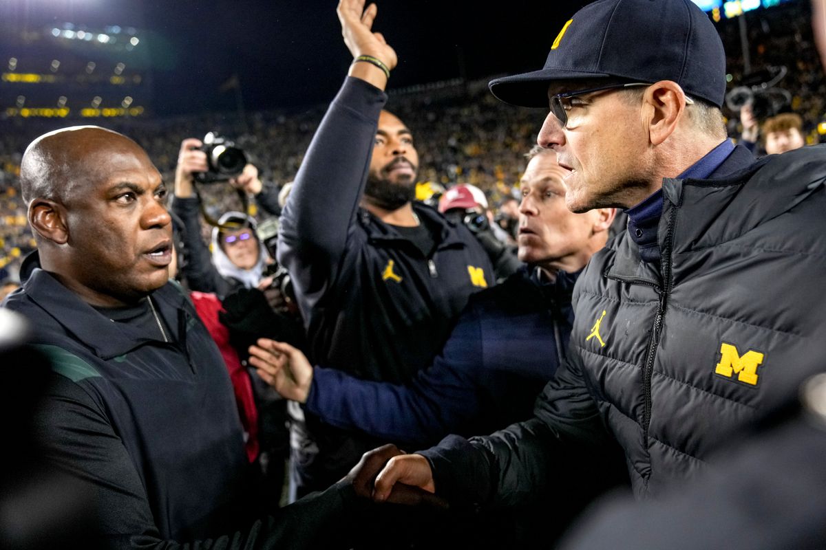 Mel Tucker (left) and Jim Harbaugh