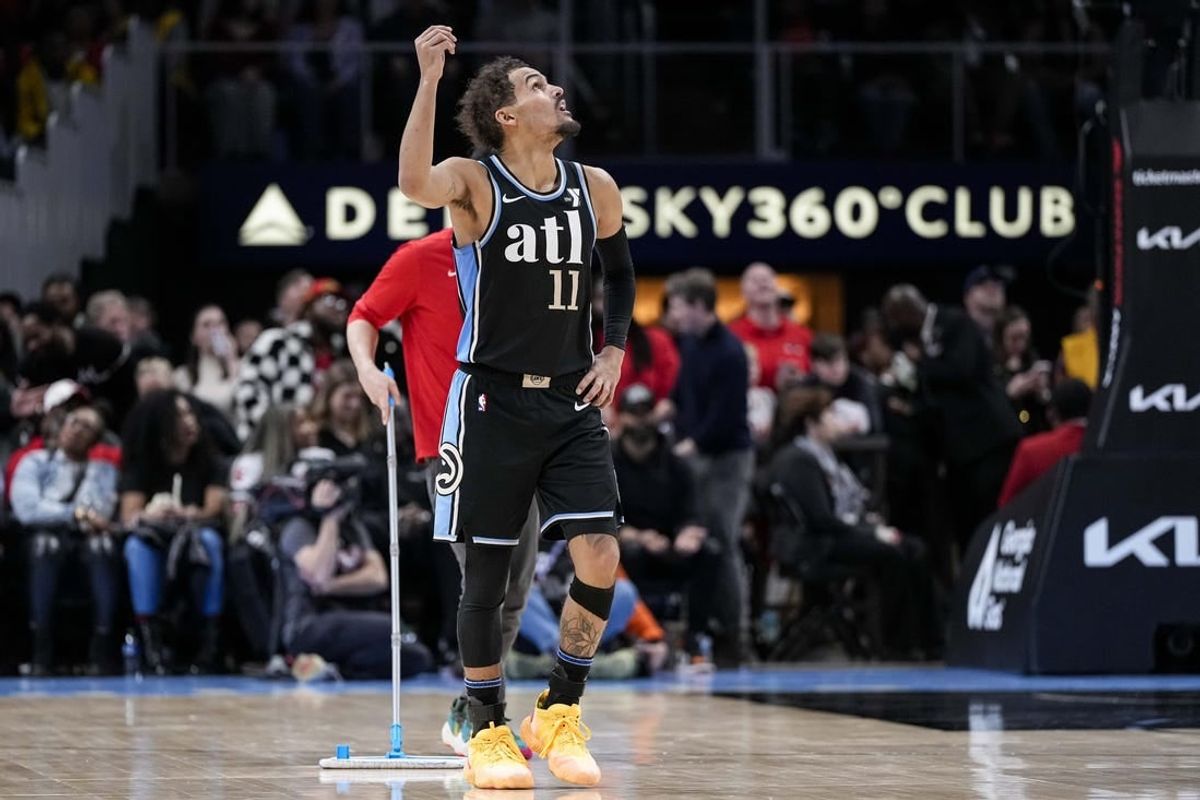 Feb 12, 2024; Atlanta, Georgia, USA; Atlanta Hawks guard Trae Young (11) gestures after being called for a technical foul against the Chicago Bulls during the second half at State Farm Arena.