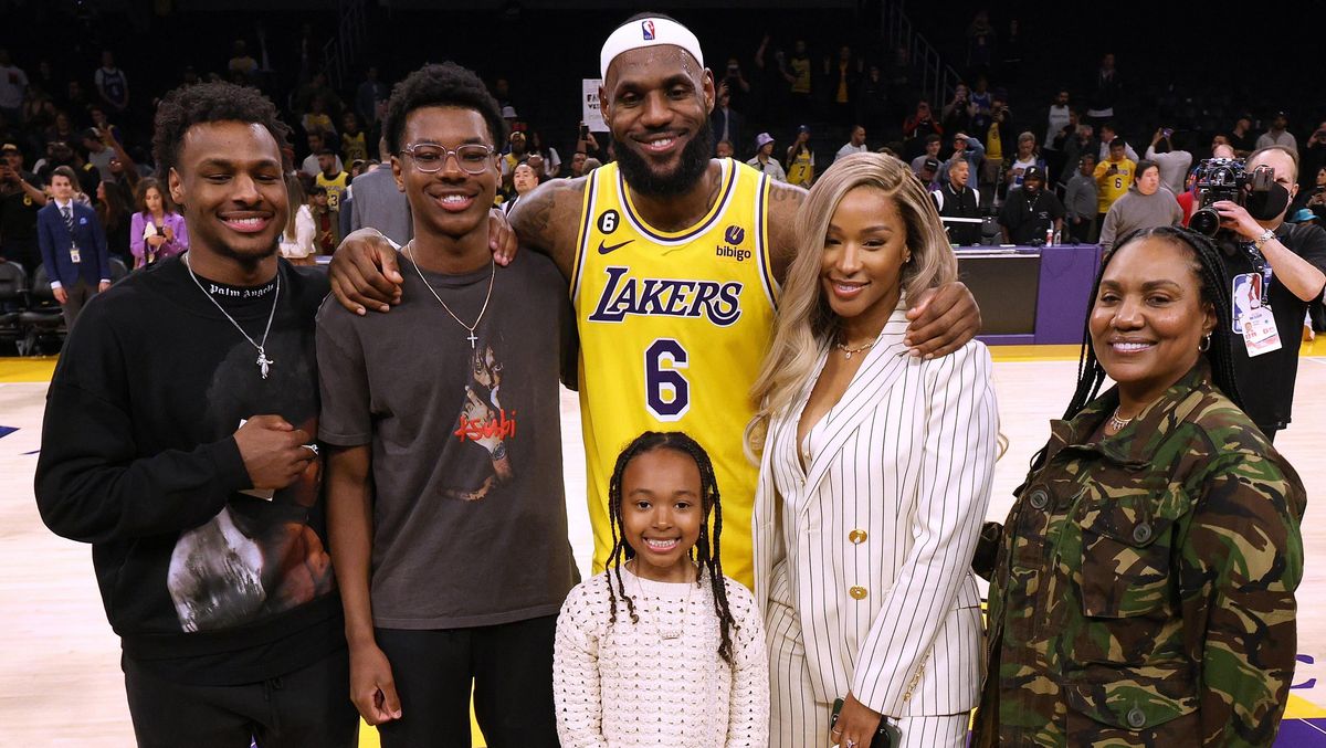 LeBron James poses for a picture with his family after passing Kareem Abdul-Jabbar to become the NBA’s all-time leading scorer.