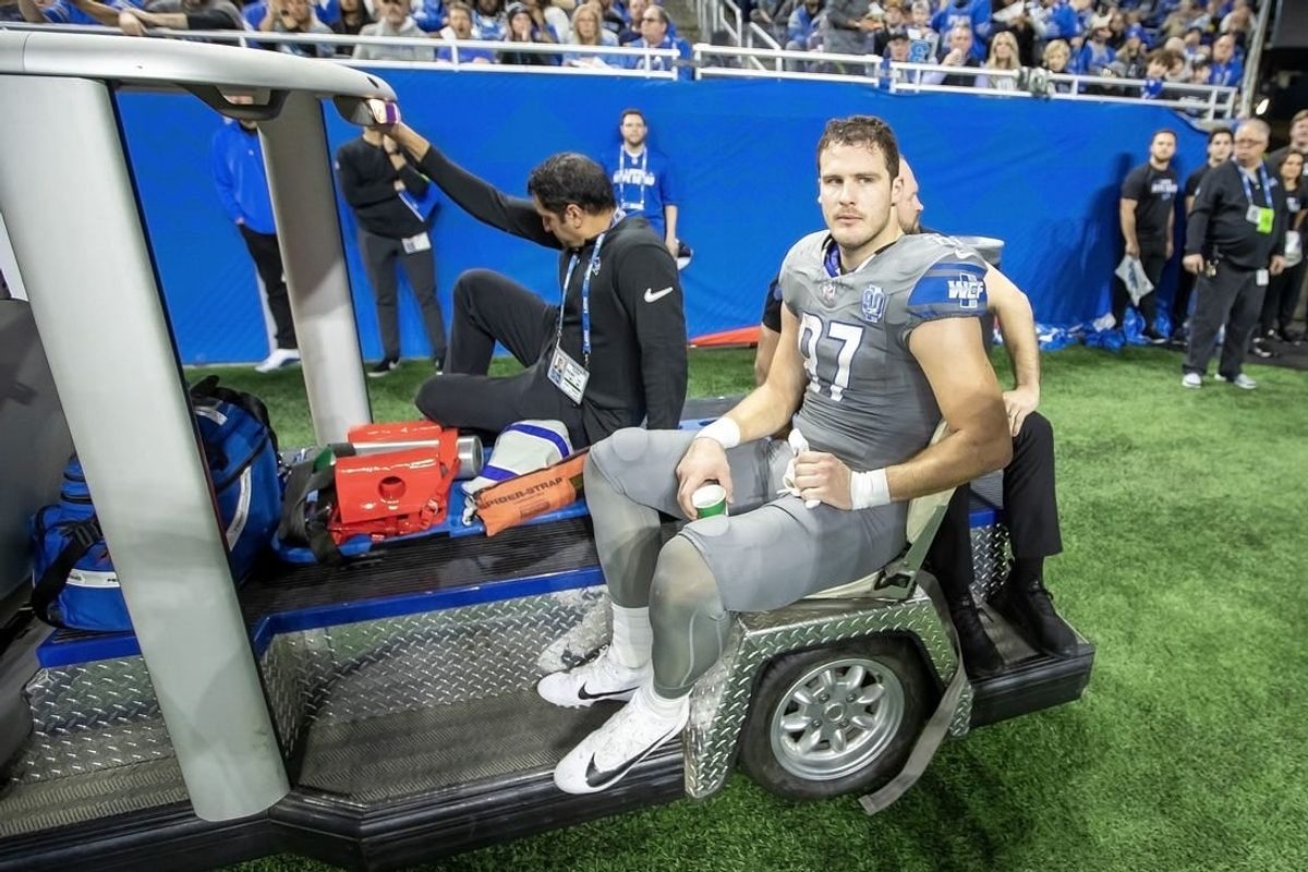 Jan 7, 2024; Detroit, Michigan, USA; Detroit Lions tight end Sam LaPorta (87) is carted off the field after an injury during second quarter of the game against the Minnesota Vikings at Ford Field.