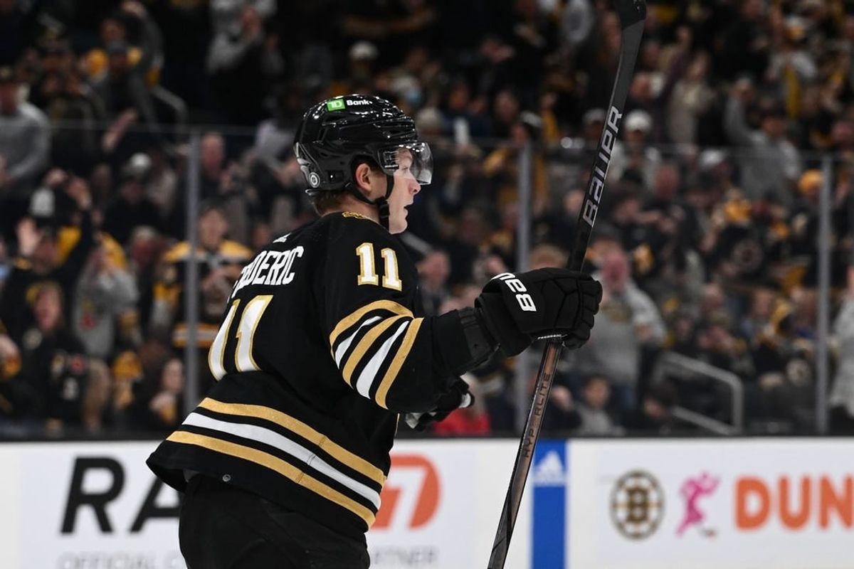 Jan 6, 2024; Boston, Massachusetts, USA; Boston Bruins center Trent Frederic (11) reacts after scoring a goal against the Tampa Bay Lightning during the first period at the TD Garden.