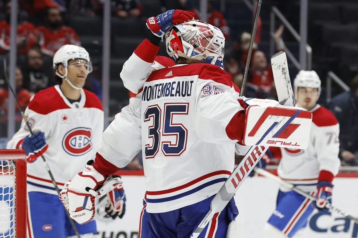 Feb 6, 2024; Washington, District of Columbia, USA; Montreal Canadiens goaltender Sam Montembeault (35) celebrates with teammates after their game against the Washington Capitals at Capital One Arena.