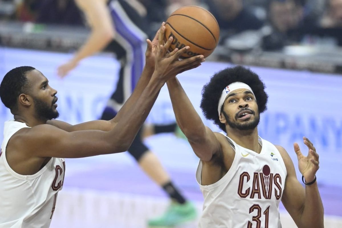 Feb 5, 2024; Cleveland, Ohio, USA; Cleveland Cavaliers center Jarrett Allen (31) rebounds beside forward Evan Mobley (4) in the first quarter against the Sacramento Kings at Rocket Mortgage FieldHouse.