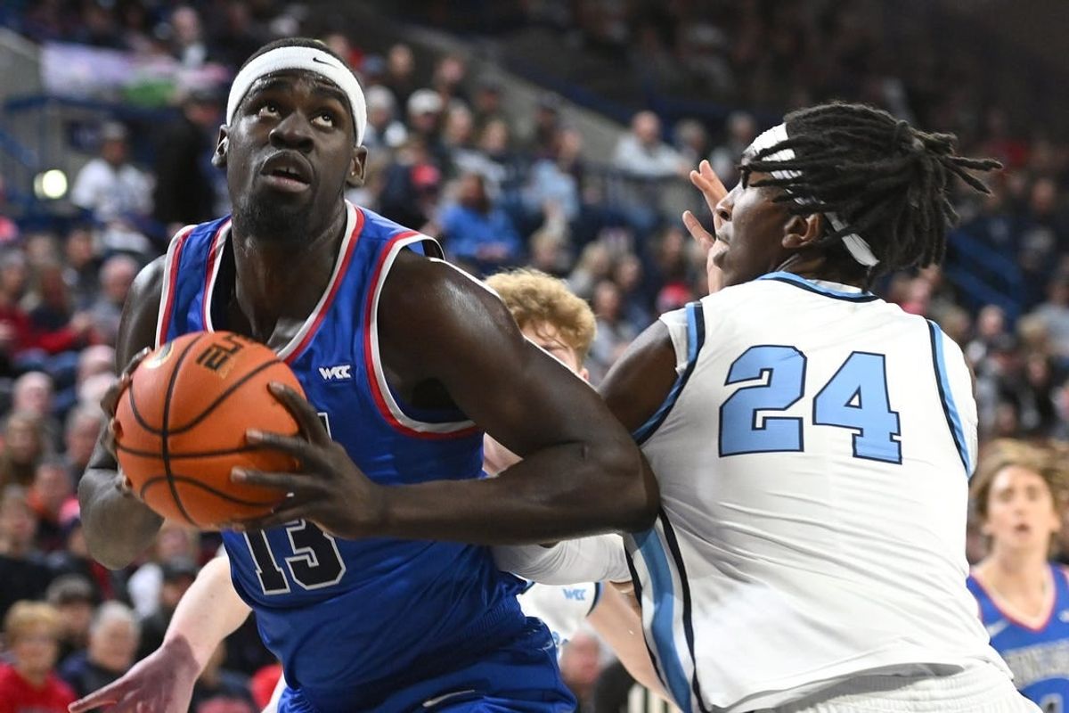 Jan 6, 2024; Spokane, Washington, USA; Gonzaga Bulldogs forward Graham Ike (13) shoots the ball against San Diego Toreros center Steven Jamerson II (24) in the first half at McCarthey Athletic Center.