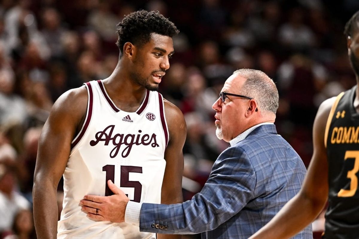 Nov 6, 2023; College Station, Texas, USA; Texas A&M Aggies head coach Buzz Williams speaks with Henry Coleman III during a time out in the second half against the Texas A&M Commerce at Reed Arena.