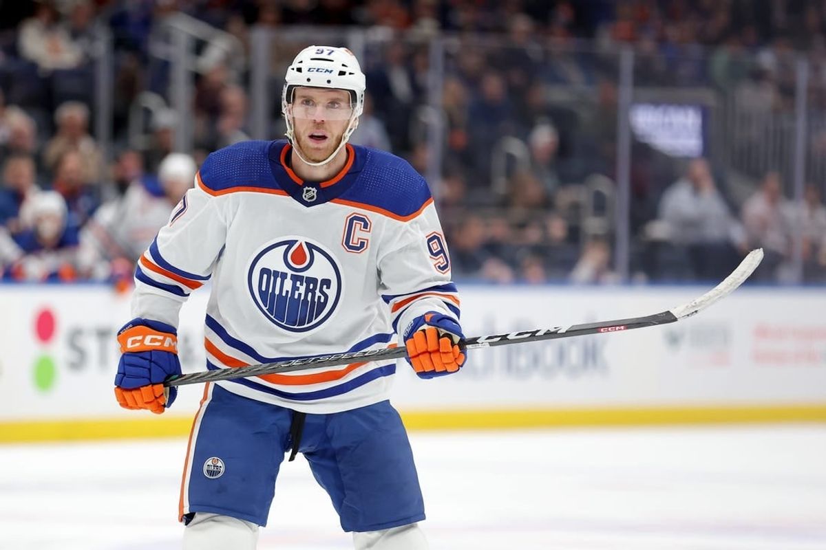 Dec 19, 2023; Elmont, New York, USA; Edmonton Oilers center Connor McDavid (97) skates against the New York Islanders during the first period at UBS Arena.