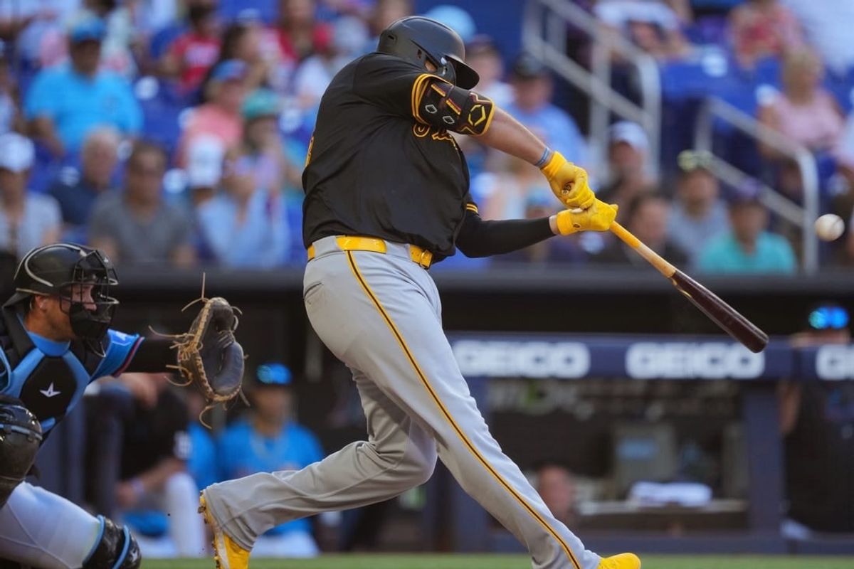 Mar 31, 2024; Miami, Florida, USA;  Pittsburgh Pirates first baseman Rowdy Tellez (44) hits a two-run home run in the seventh inning to give the Pirates the lead over the Miami Marlins at loanDepot Park.