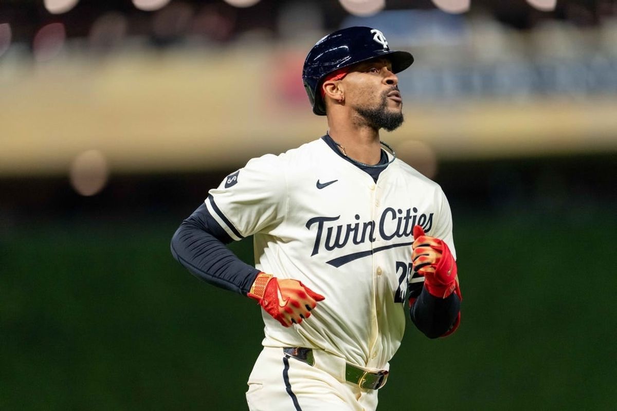 Apr 23, 2024; Minneapolis, Minnesota, USA; Minnesota Twins outfielder Byron Buxton (25) hits a solo home run in the ninth inning against the Chicago White Sox at Target Field.