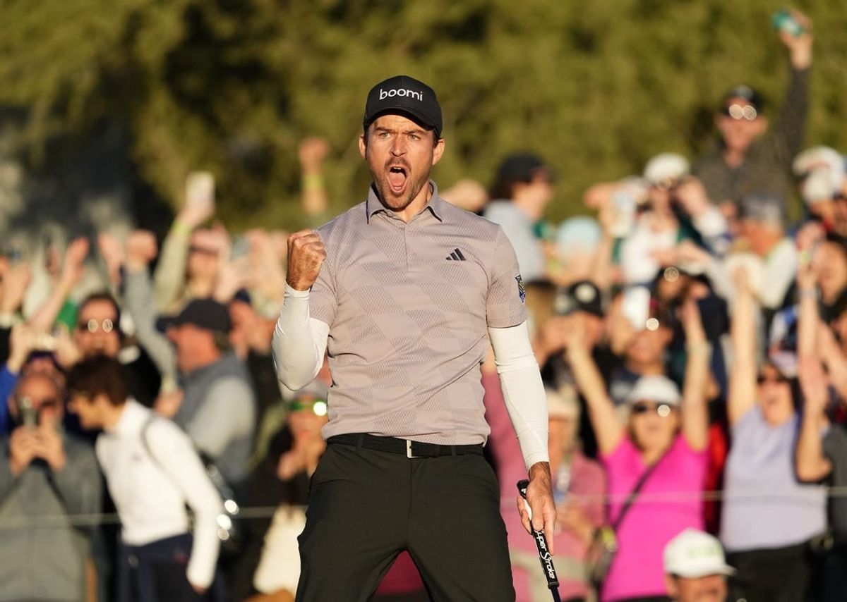 Feb 11, 2024; Scottsdale, AZ, USA; Nick Taylor reacts after making his birdie putt to force a playoff with Charley Hoffman
on the 18th hole during the final round of the WM Phoenix Open at TPC Scottsdale.