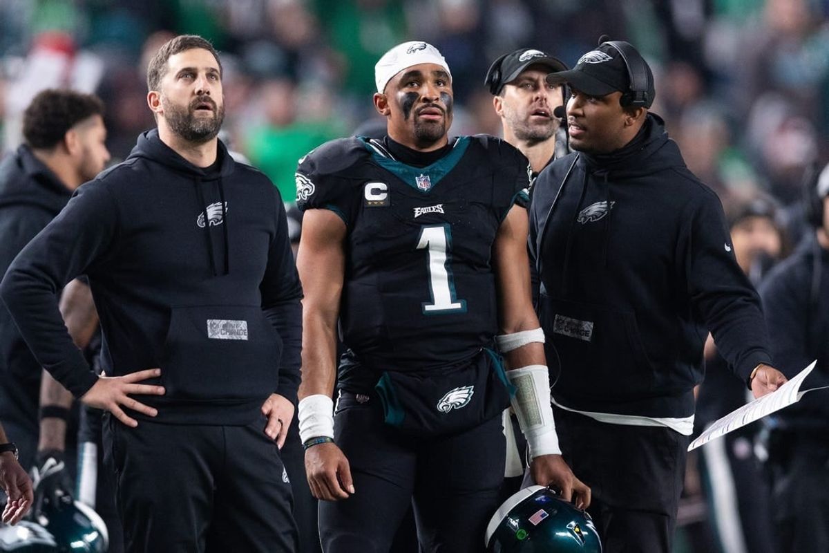 Dec 25, 2023; Philadelphia, Pennsylvania, USA; Philadelphia Eagles head coach Nick Sirianni (L) and quarterback Jalen Hurts (1) and offensive coordinator Brian Johnson (R) talk during the second quarter against the New York Giants at Lincoln Financial Field.