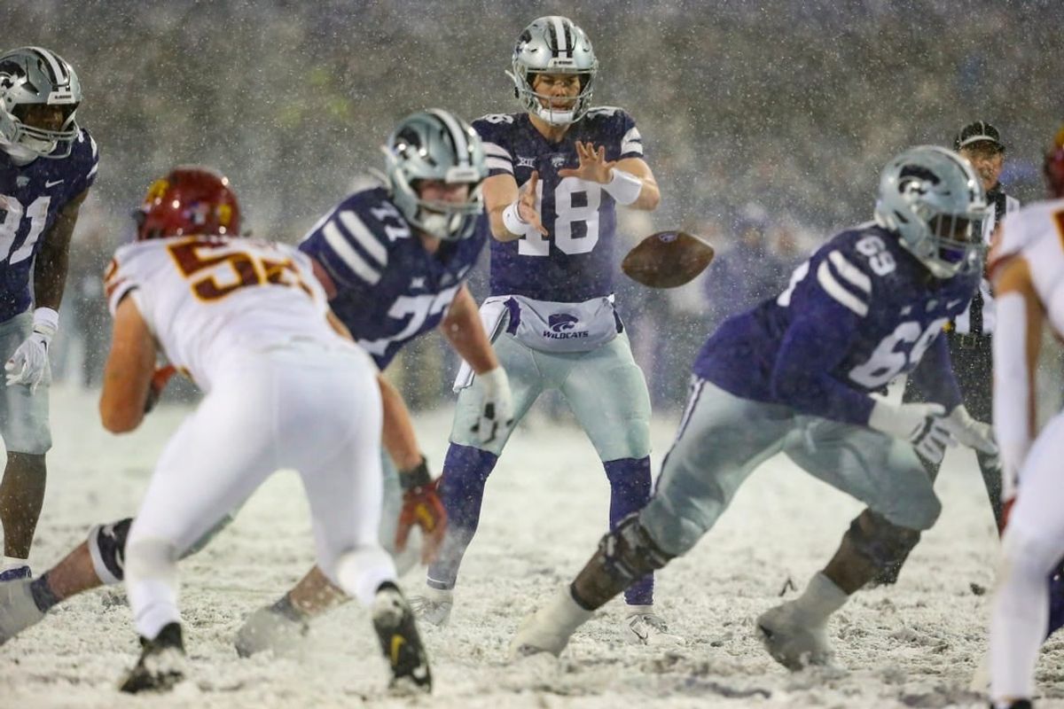 Nov 25, 2023; Manhattan, Kansas, USA; Kansas State Wildcats quarterback Will Howard (18) takes the snap during the second quarter against the Iowa State Cyclones at Bill Snyder Family Football Stadium.