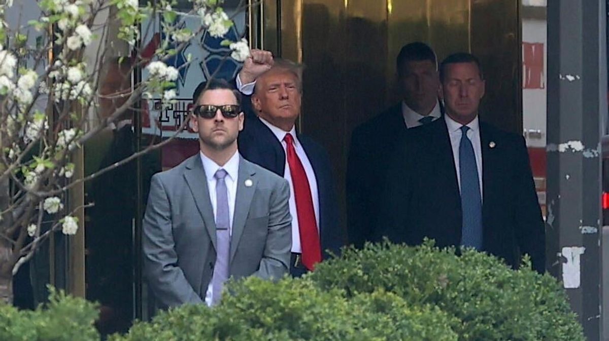 Donald Trump seen raising his fist while leaving  Trump Tower