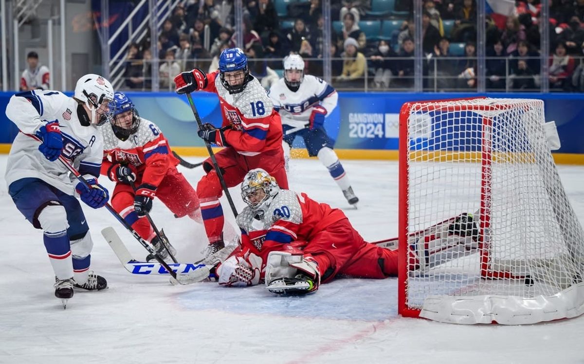 Jan 31, 2024; Gangwon-do, KOR; Mikey Berchild (USA) strikes the puck past goalkeeper Jan Larys (CZE) to score a goal and make it 0-3 in the Ice Hockey Men s 6-on-6 Tournament Gold Medal Game between Czech Republic and (USA) at the Gangneung Hockey Centre. The Winter Youth Olympic Games, Gangwon, South Korea, Wednesday 31 January 2024.