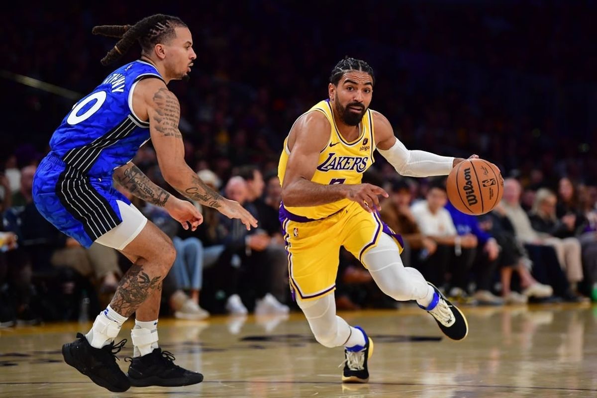 Oct 30, 2023; Los Angeles, California, USA; Los Angeles Lakers guard Gabe Vincent (7) moves to the basket against Orlando Magic guard Cole Anthony (50) during the second half at Crypto.com Arena.